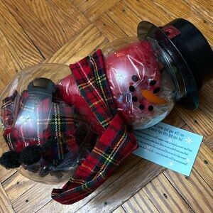 A set of snow-person accessories in a container